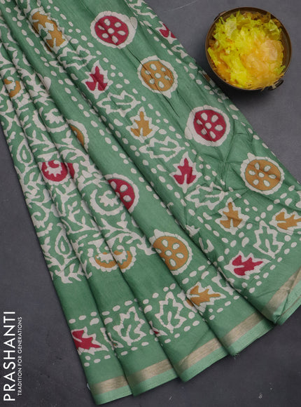 Semi dola saree paastel green with allover batik prints and zari woven border
