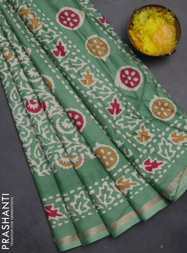 Semi dola saree paastel green with allover batik prints and zari woven border