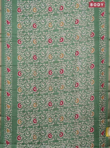 Semi dola saree paastel green with allover batik prints and zari woven border
