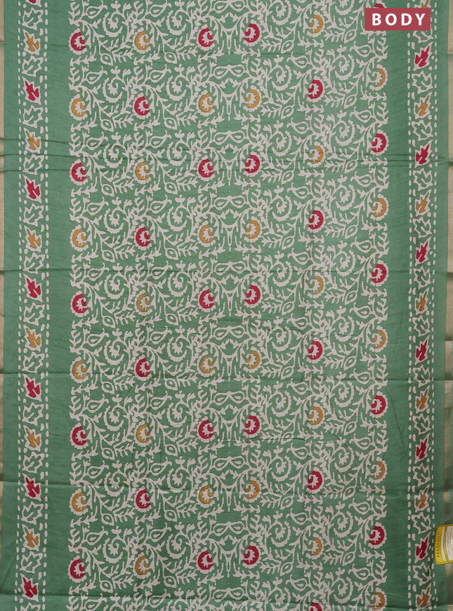 Semi dola saree paastel green with allover batik prints and zari woven border