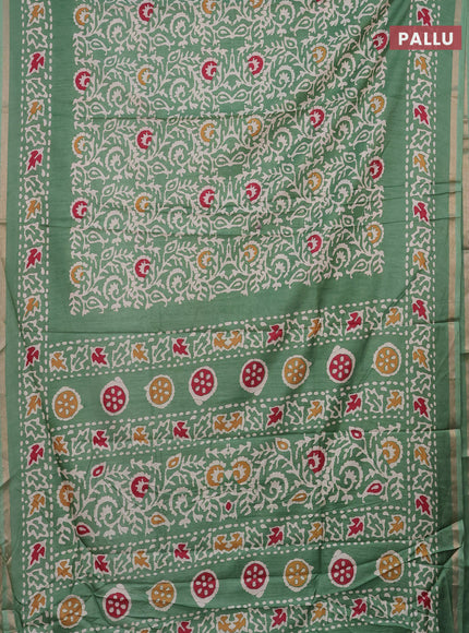 Semi dola saree paastel green with allover batik prints and zari woven border