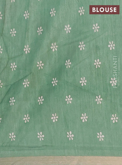 Semi dola saree paastel green with allover batik prints and zari woven border