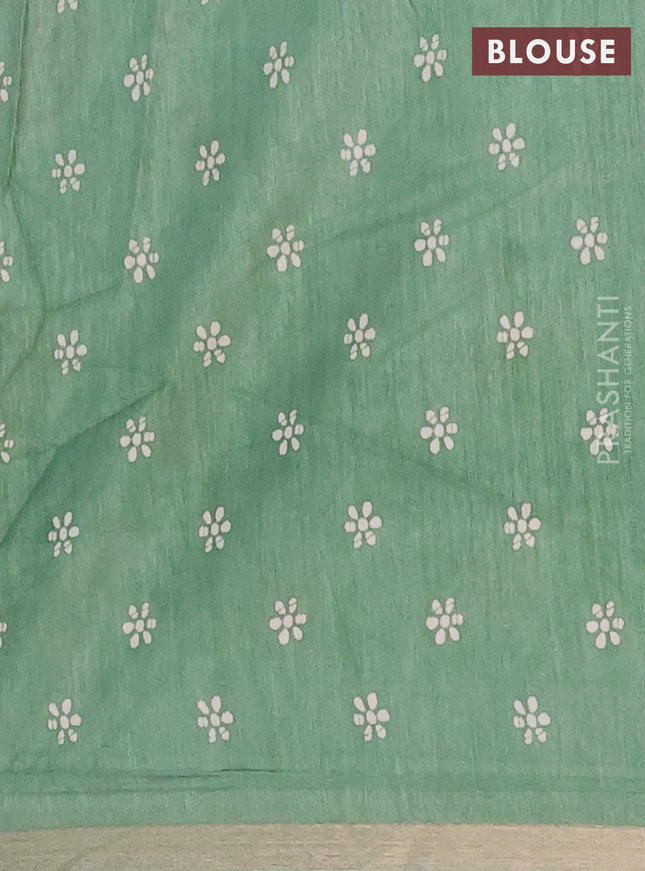Semi dola saree paastel green with allover batik prints and zari woven border