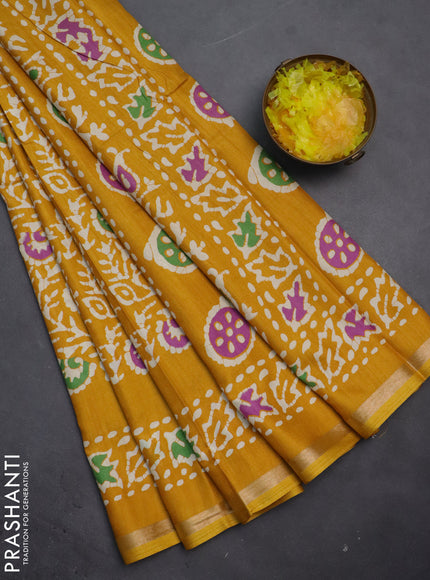 Semi dola saree mustard yellow with allover batik prints and zari woven border