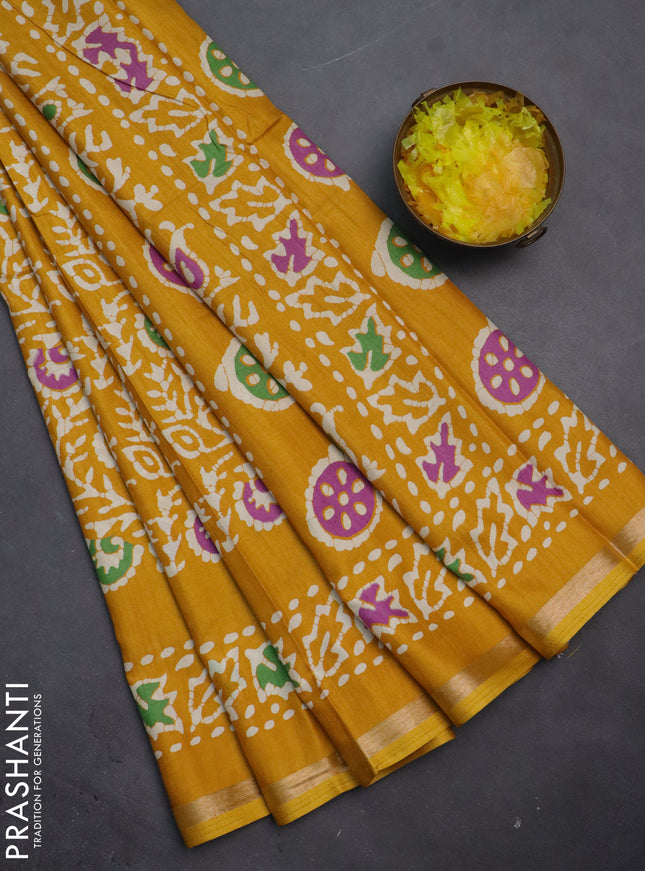 Semi dola saree mustard yellow with allover batik prints and zari woven border