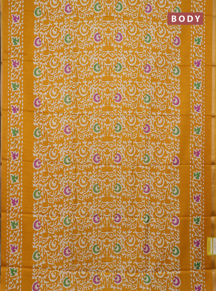 Semi dola saree mustard yellow with allover batik prints and zari woven border