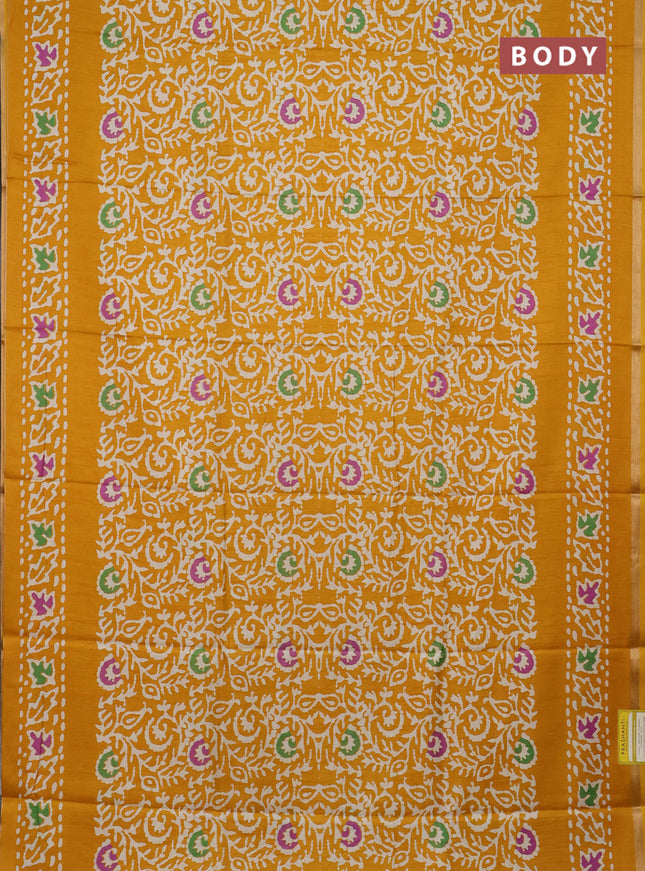 Semi dola saree mustard yellow with allover batik prints and zari woven border
