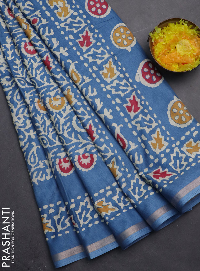 Semi dola saree blue with allover batik prints and zari woven border