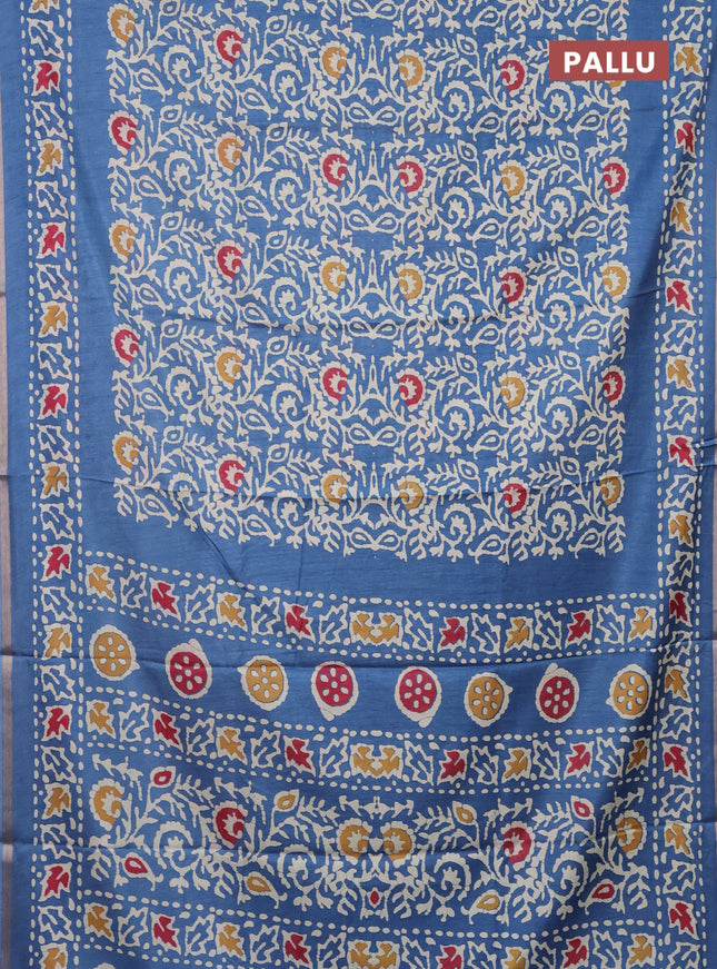 Semi dola saree blue with allover batik prints and zari woven border