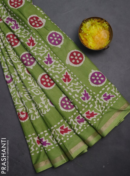 Semi dola saree light green with allover batik prints and zari woven border