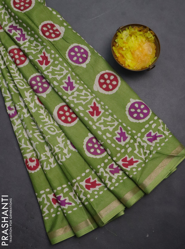 Semi dola saree light green with allover batik prints and zari woven border