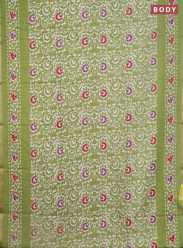 Semi dola saree light green with allover batik prints and zari woven border