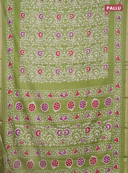 Semi dola saree light green with allover batik prints and zari woven border