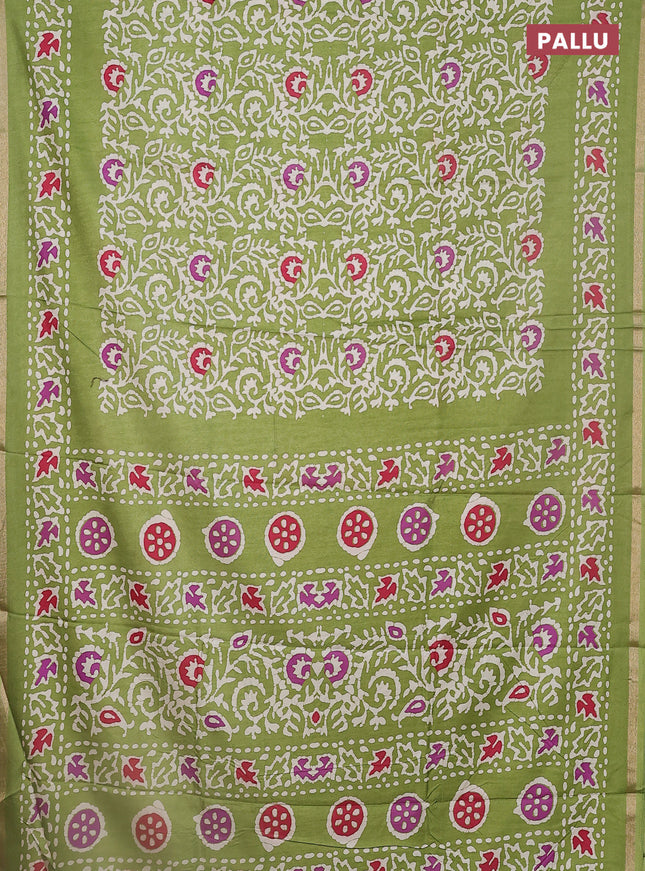 Semi dola saree light green with allover batik prints and zari woven border