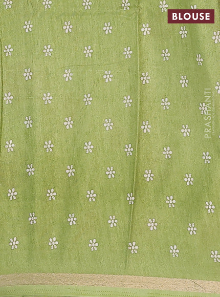 Semi dola saree light green with allover batik prints and zari woven border
