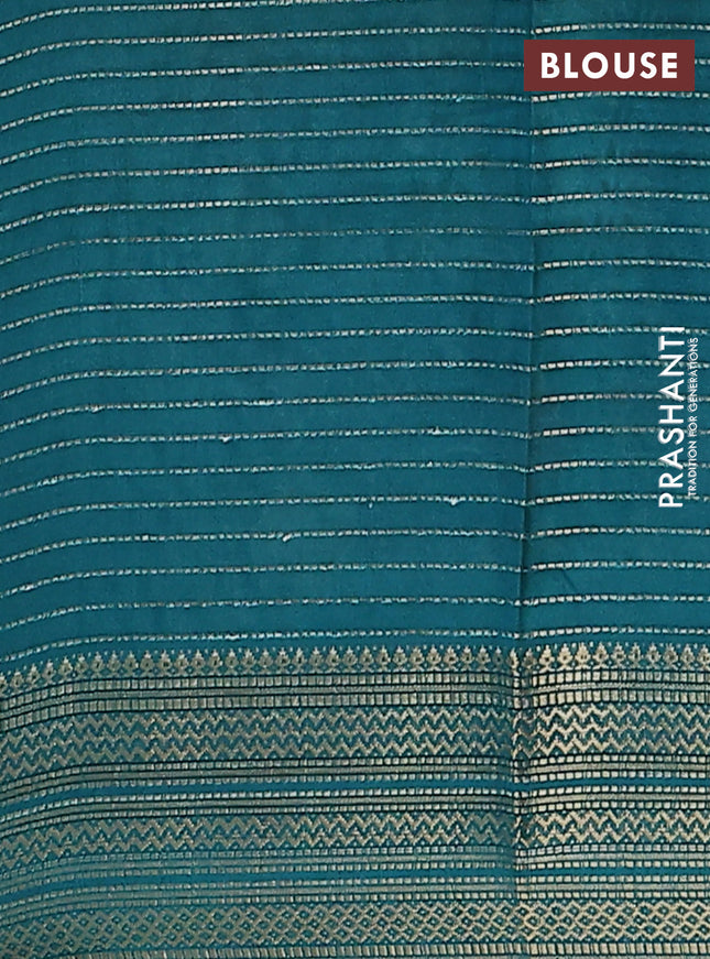 Semi dola saree maroon and peacock blue with allover zari weaves & floral prints and zari woven border