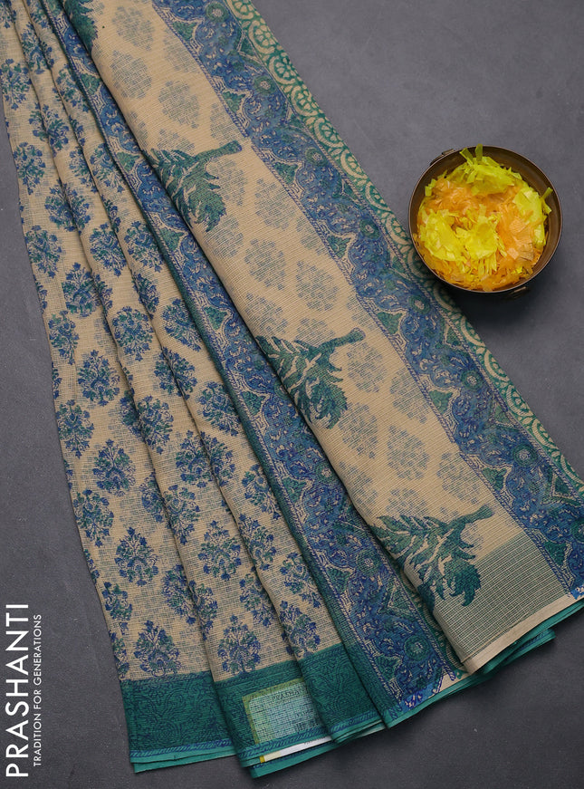 Kota doria saree beige and teal green shade with allover block prints and printed border