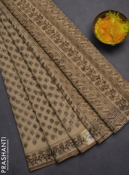 Kota doria saree beige and pastel brown with allover block prints and printed border