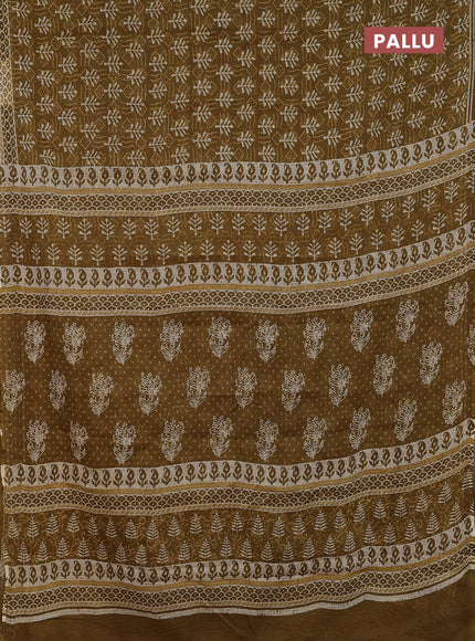 Kota doria saree mehendi green and off white with allover dabu prints and printed border