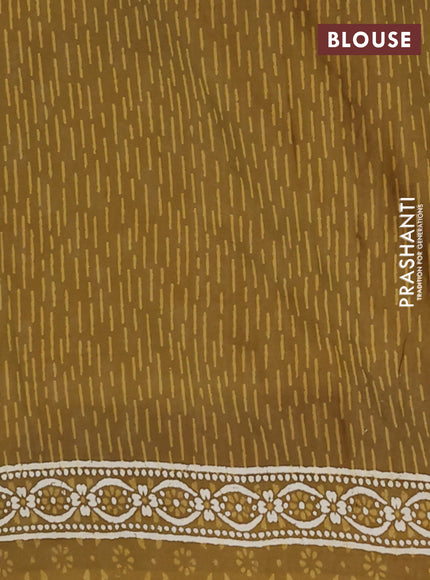 Kota doria saree mehendi green with allover dabu prints and printed border