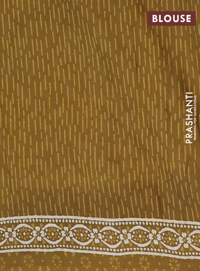 Kota doria saree mehendi green with allover dabu prints and printed border