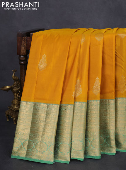 Bangalori silk saree mustard yellow and teal green with zari woven buttas and long zari woven border and Butta style