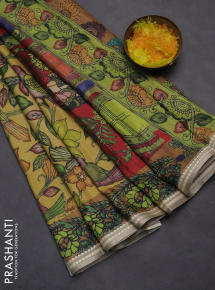 Semi tussar saree yellow and dark mustard with allover kalamkari prints and printed border