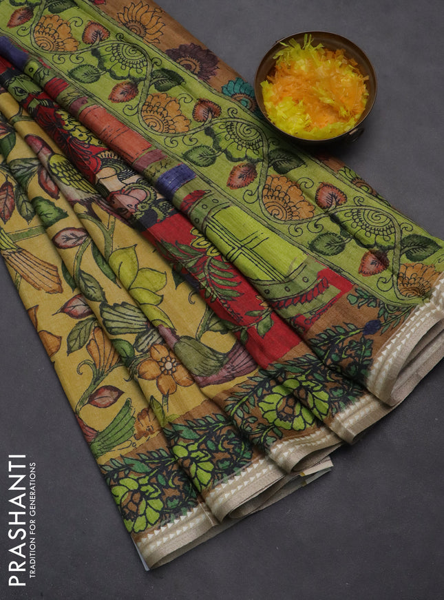 Semi tussar saree yellow and dark mustard with allover kalamkari prints and printed border