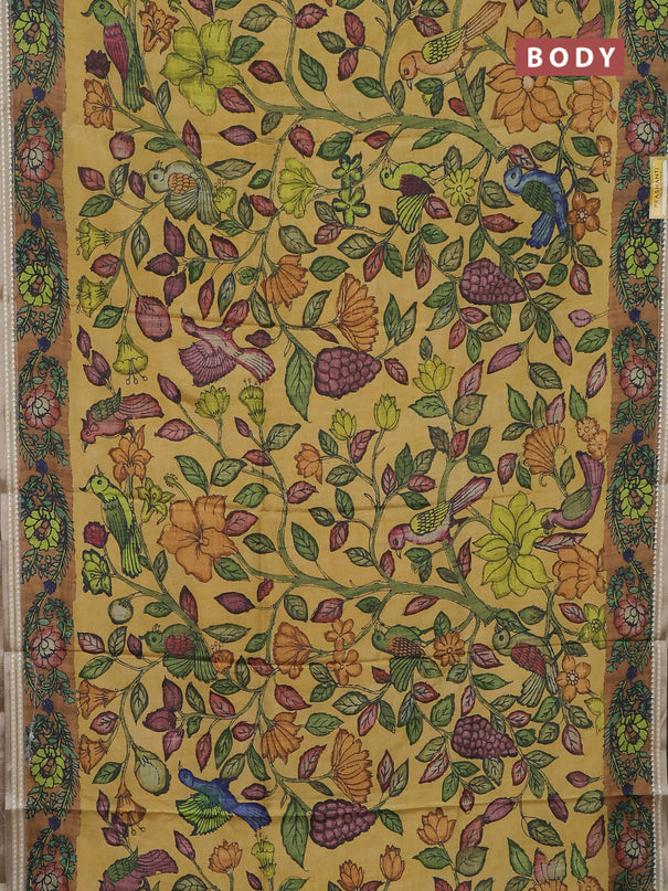 Semi tussar saree yellow and dark mustard with allover kalamkari prints and printed border
