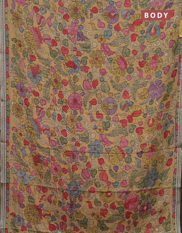 Semi tussar saree mustard yellow and pastel green with allover kalamkari prints and printed border