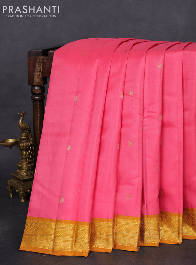 Pure kanchipuram silk saree peach pink and dark mustard with zari woven buttas and zari woven korvai border
