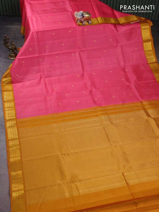 Pure kanchipuram silk saree peach pink and dark mustard with zari woven buttas and zari woven korvai border