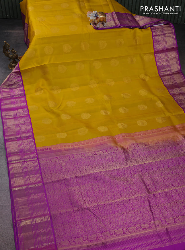 Pure kanchipuram silk saree yellow and purple with zari woven buttas and zari woven korvai border