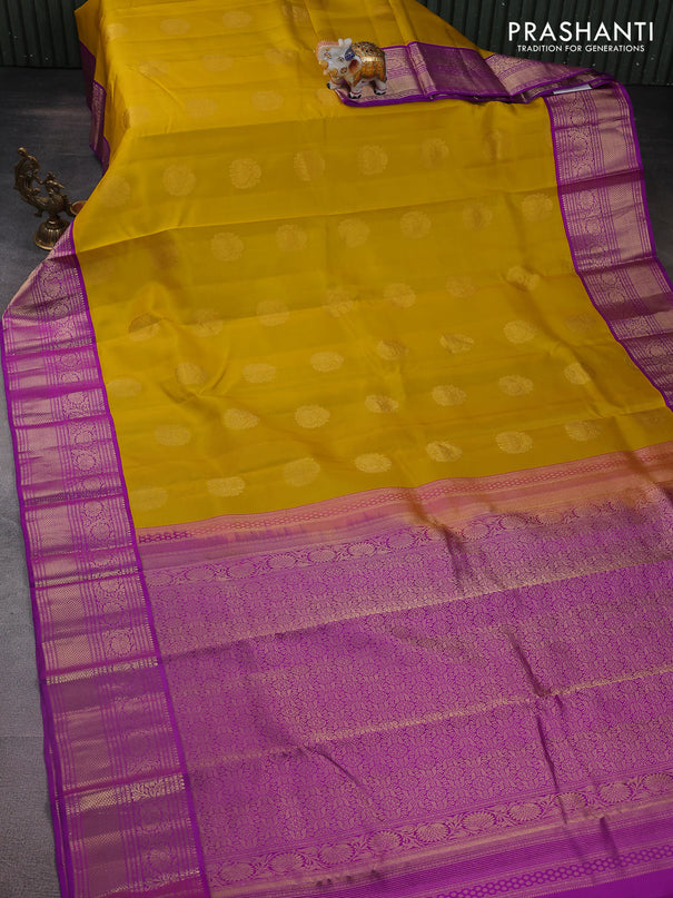 Pure kanchipuram silk saree yellow and purple with zari woven buttas and zari woven korvai border