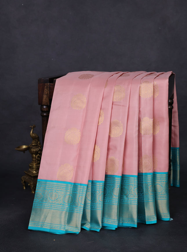 Pure kanchipuram silk saree pastel peach and teal blue with zari woven buttas and zari woven korvai border