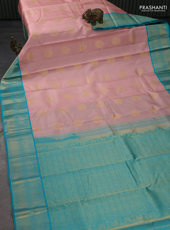 Pure kanchipuram silk saree pastel peach and teal blue with zari woven buttas and zari woven korvai border