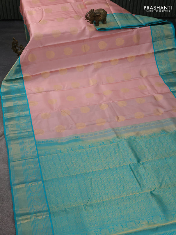 Pure kanchipuram silk saree pastel peach and teal blue with zari woven buttas and zari woven korvai border