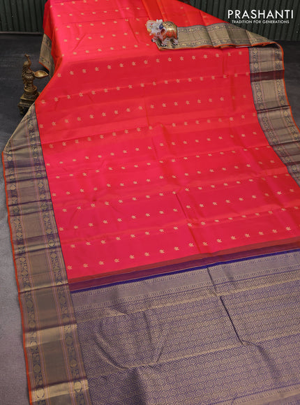 Pure kanchipuram silk saree dual shade of pinkish orange and navy blue with zari woven buttas and zari woven border
