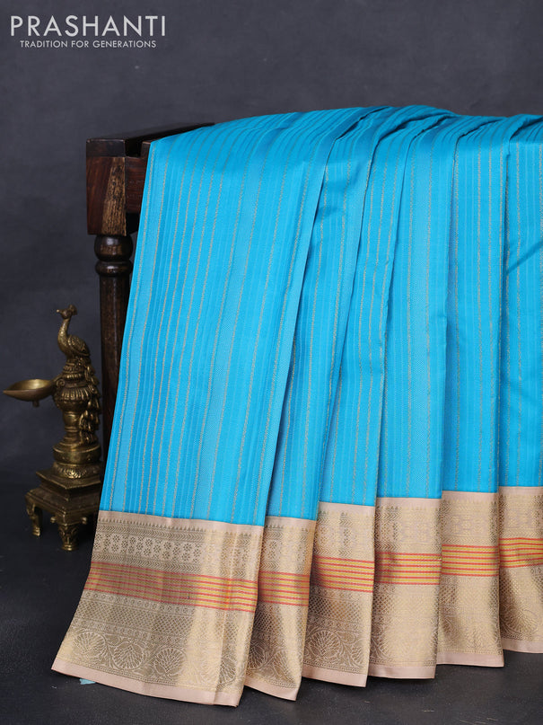 Pure kanchipuram silk saree light blue and sandal with allover self emboss & zari weaves and zari woven korvai border