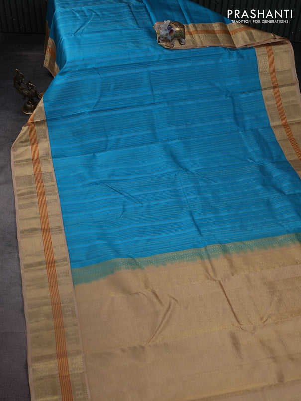 Pure kanchipuram silk saree light blue and sandal with allover self emboss & zari weaves and zari woven korvai border