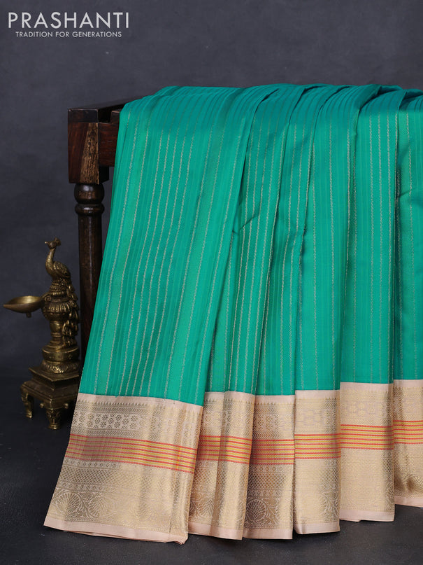Pure kanchipuram silk saree teal blue and sandal with allover self emboss & zari weaves and zari woven korvai border