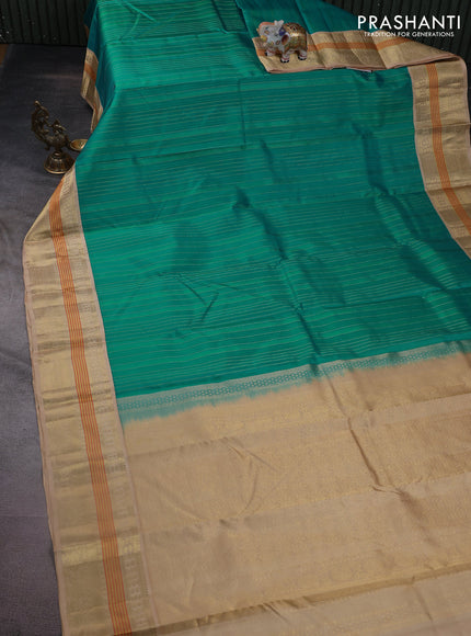 Pure kanchipuram silk saree teal blue and sandal with allover self emboss & zari weaves and zari woven korvai border
