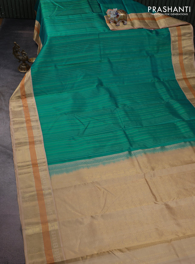 Pure kanchipuram silk saree teal blue and sandal with allover self emboss & zari weaves and zari woven korvai border