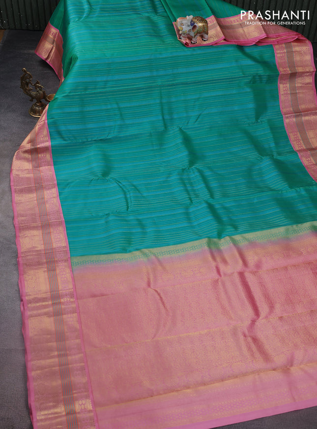 Pure kanchipuram silk saree teal green shade and light pink with allover self emboss & zari weaves and zari woven korvai border