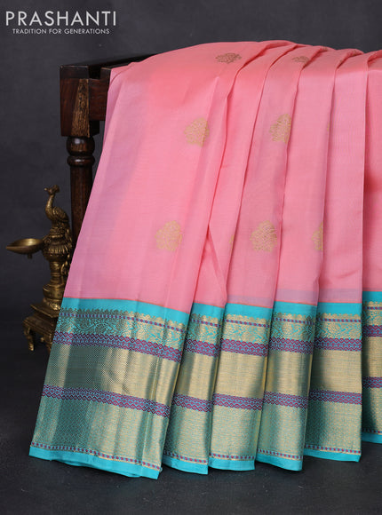 Pure kanchipuram silk saree peach shade and teal blue with zari woven buttas and long rich zari woven border