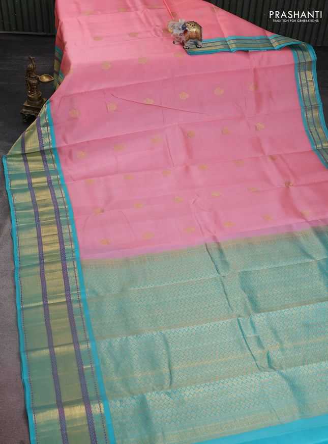 Pure kanchipuram silk saree peach shade and teal blue with zari woven buttas and long rich zari woven border