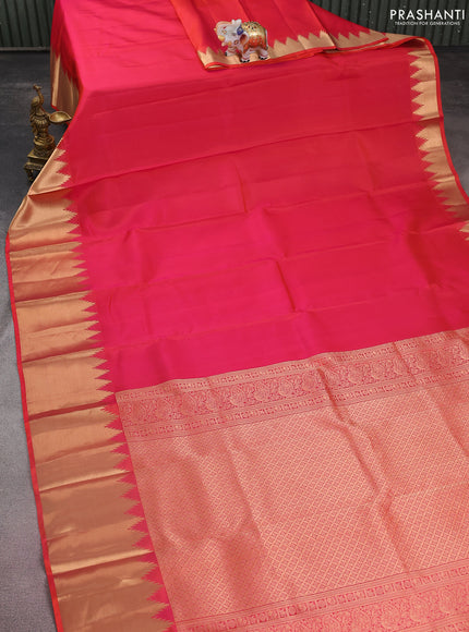 Pure kanchipuram silk saree dual shade of pinkish orange with plain body and temple design zari woven border