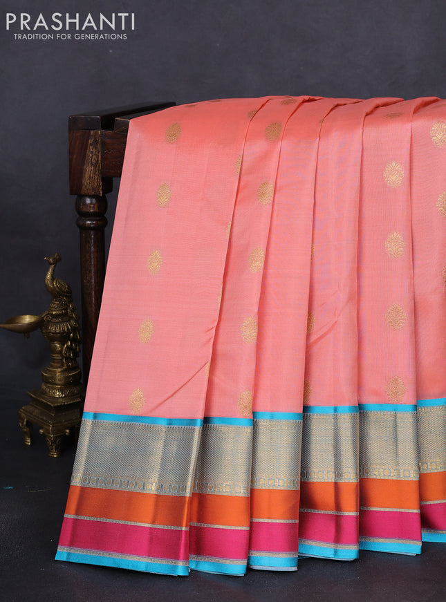 Pure kanchipuram silk saree peach orange and teal blue with zari woven buttas and zari woven border