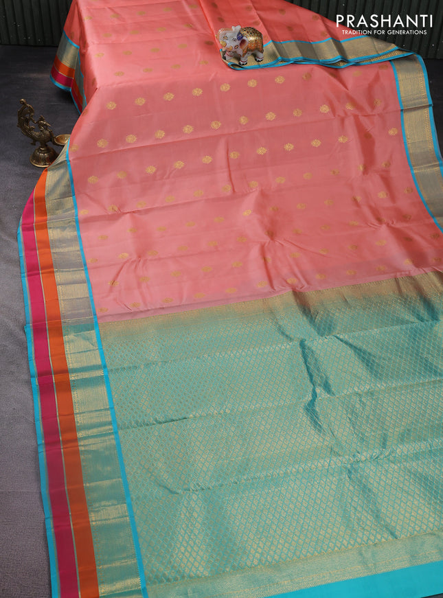 Pure kanchipuram silk saree peach orange and teal blue with zari woven buttas and zari woven border