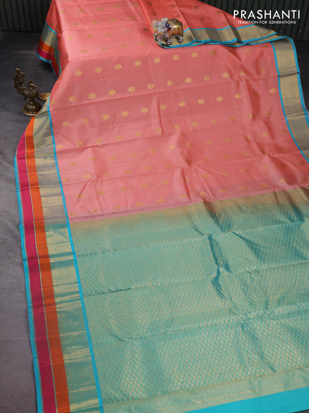 Pure kanchipuram silk saree peach orange and teal blue with zari woven buttas and zari woven border
